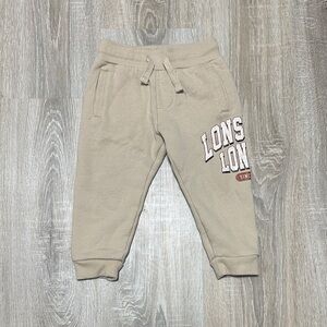 Kids Beige Drawstring Joggers with Graphic